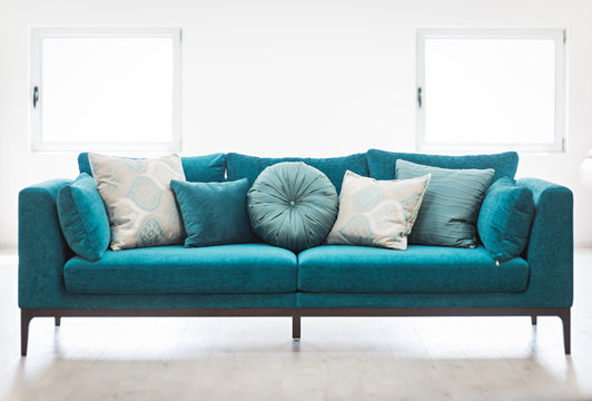 Bright Living Room Interior With Blue Sofa And Cushions