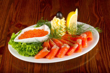 Sliced trout and red caviar