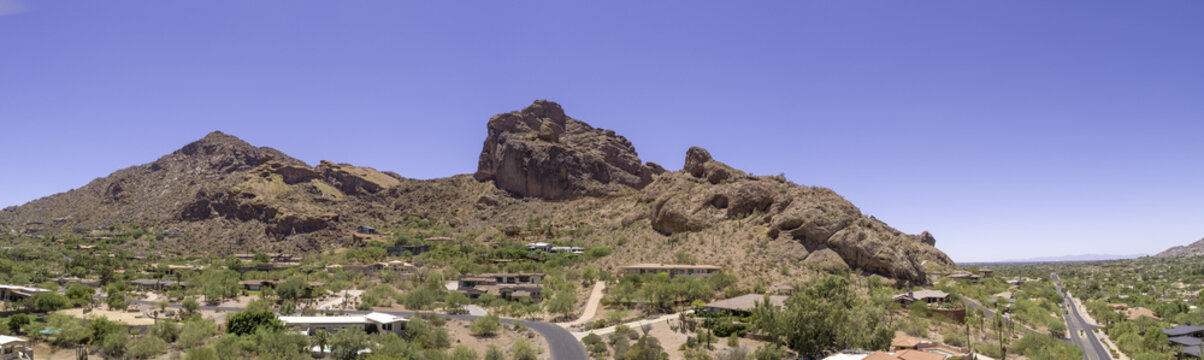 This is a 4 image aerial panoramic of iconic Camelback Mountain in Phoenix, Arizona, USA