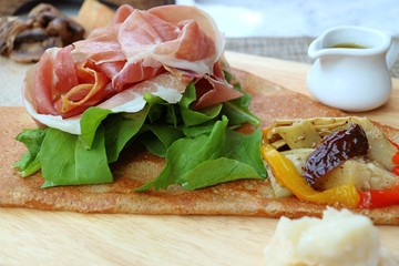 Delectable cold cuts ham with fresh vegetable and cheese of European style Appetizer Crepe  