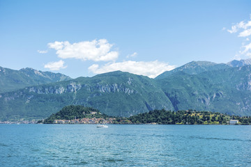 Lago di Como in Italy and Blooming Red Geranium Flowers ,Como Lake Background