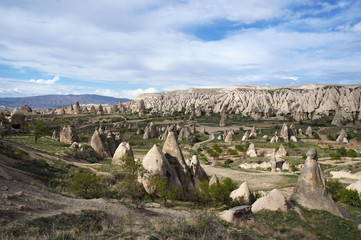 Valley with fairy chimneys and cave churchs near Goreme. Turkey, Cappadocia