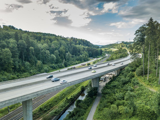  Aerial view of highway bridge in forest in Switzerland, Europe