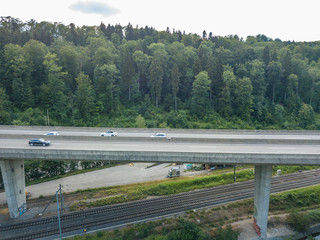  Aerial view of highway bridge in forest in Switzerland, Europe