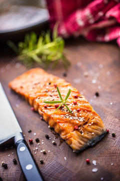 Salmon fillet grilled with salt pepper sesame and herb rosemary