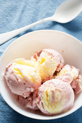 Raspberry ice cream with meringue pieces and clotted cream dairy ice cream