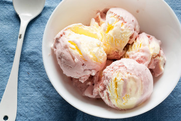 Raspberry ice cream with meringue pieces and clotted cream dairy ice cream