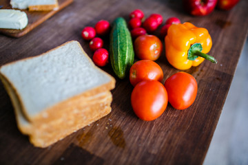 Fresh vegetables and slices of bread for healthy breakfast