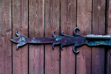 texture smooth wooden boards painted with age with vintage iron loop, natural light, copy space, closeup,