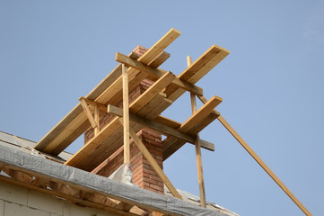 Construction of the chimney on the roof.