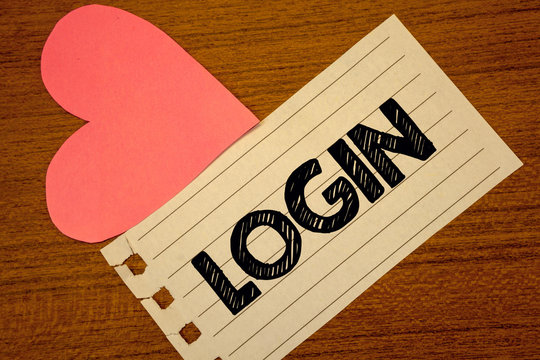 Word writing text Login. Business concept for Act of entering into a computer database or system Starting session Paperpiece page heart table background typing job clerk study material.