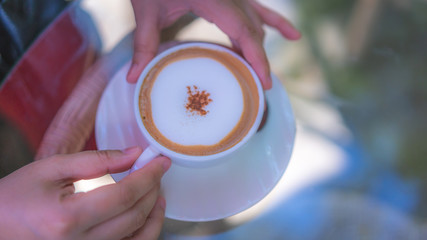 Drinking Hot Cappuccino Coffee