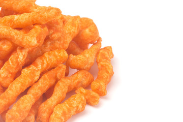 Long and Thing Crunchy Orange Cheesy Chips on a White Background