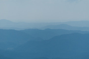 A series of mountain ridges receding into the blue haze. In North Carolina, USA.