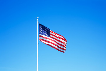 American flag with blue sky for Memorial Day or 4th of July.