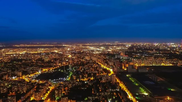 The camera moving up on the night city landscape background. time lapse