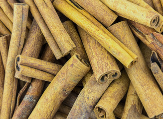dry beans brown cinnamon stick spice background basis close-up