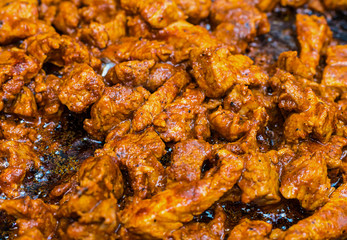 many fried hot spicy meat slices of pork appetizer for beer