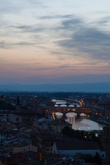 Florence city during  sunset. Panoramic view to the river Arno, with Ponte Vecchio, Palazzo Vecchio and Cathedral of Santa Maria del Fiore (Duomo), Florence, Italy
