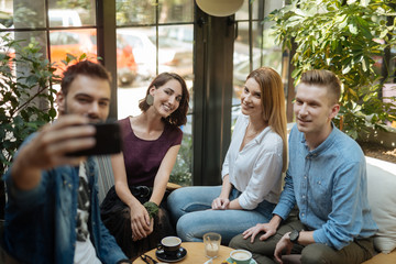 Friends at a coffee shop during a summer vacation