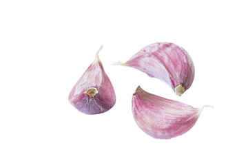 Three cloves of garlic isolated on white background.