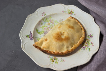 Homemade pies with egg, onion and chicken.