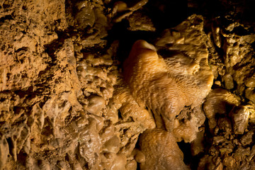 Stalactites and stalagmites inside natural limestone cave. Natural formations.