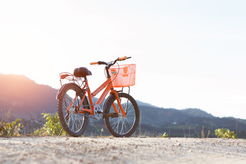 Fototapeta premium bike on mountain at sunset time