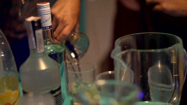 pouring drinks at a party. drinks table