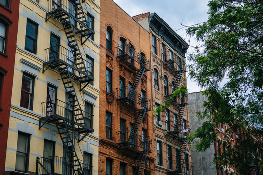 Brick residential buildings in East Village, Manhattan, New York City. © jonbilous
