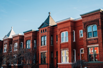 Red brick row houses near U Street in Washington, DC. © jonbilous