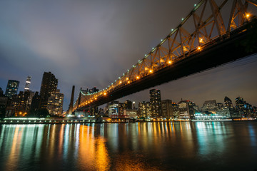 Fototapeta na wymiar The Queensboro Bridge at night, seen from Roosevelt Island in New York City.