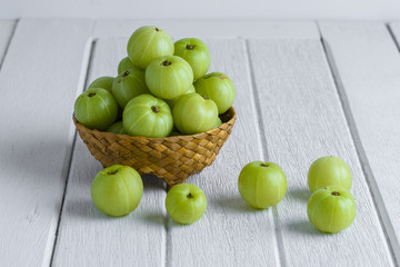 Indian gooseberry on wooden table