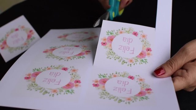 Cutting out designs of Spanish celebration message