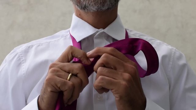 Man Taking Off Tie