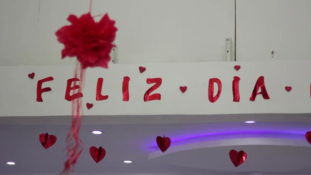 Open shot of happy day sign in spanish