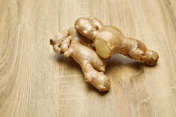 Ginger root sliced on wooden table