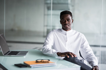 Portrait of a happy casual black man at modern office.