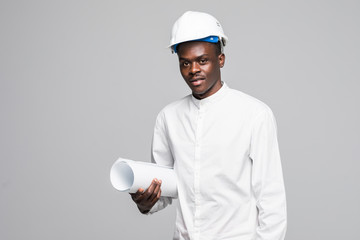 Portrait of confident, smiling afro american architect engineer man with blueprint, looking at...