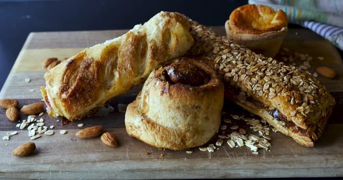 Artistic shot of Mexican sweet bread or pan dulce on a wooden cutting board