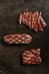 Hot Juicy Whole Machete Steak or Denver Steak on Barbecue Grill Background