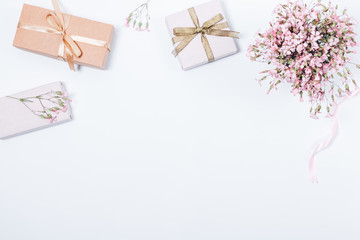 Feminine festive pink flat lay with bouquet