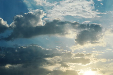 Beautiful dawn with the rays of the sun through the clouds.