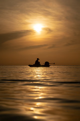 Naklejka na ściany i meble fisherman silhouette long tail boat life