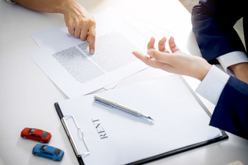 Car and Home for rent concept, broker agent presenting and consult to customer to decision making sign form agreement, home and car model