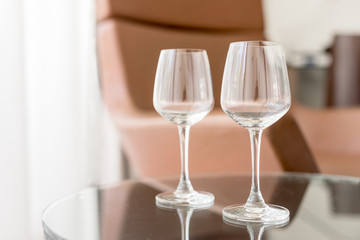 Two empty glasses on the table. Hotel