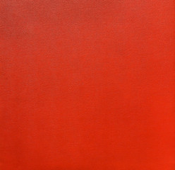 Fototapeta premium Closeup red synthetic leather texture, wall decoration layer detail background