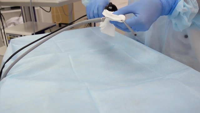 preparation of endoscopic equipment for diagnostic examination. Connecting an endoscopic tube with a light guide and a video camera