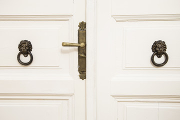 Rustic wooden white door with vintage dorknob