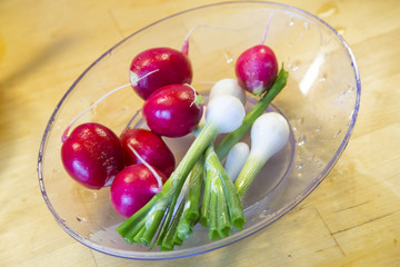 Fresh washed vegetables on wooden kitchen table